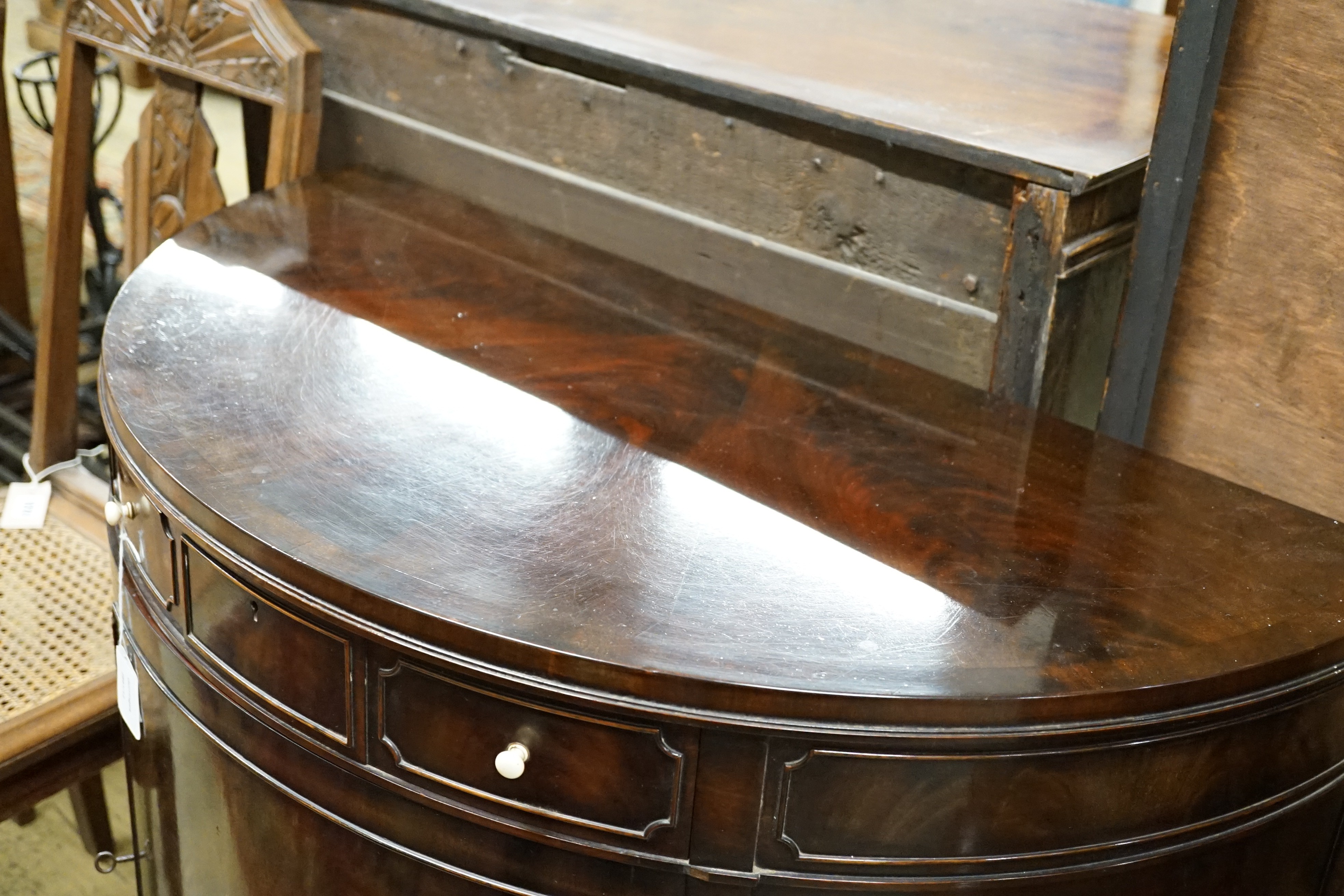 An early 20th century Maple & Co. mahogany demi-lune side cabinet with frieze drawer, width 84cm, height 84cm